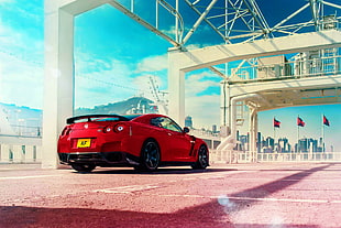 red coupe parked under the bridge HD wallpaper