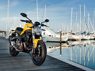 yellow naked bike on boat dock