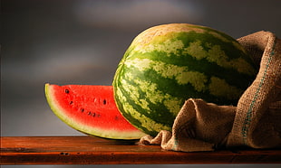 watermelon on brown wooden table