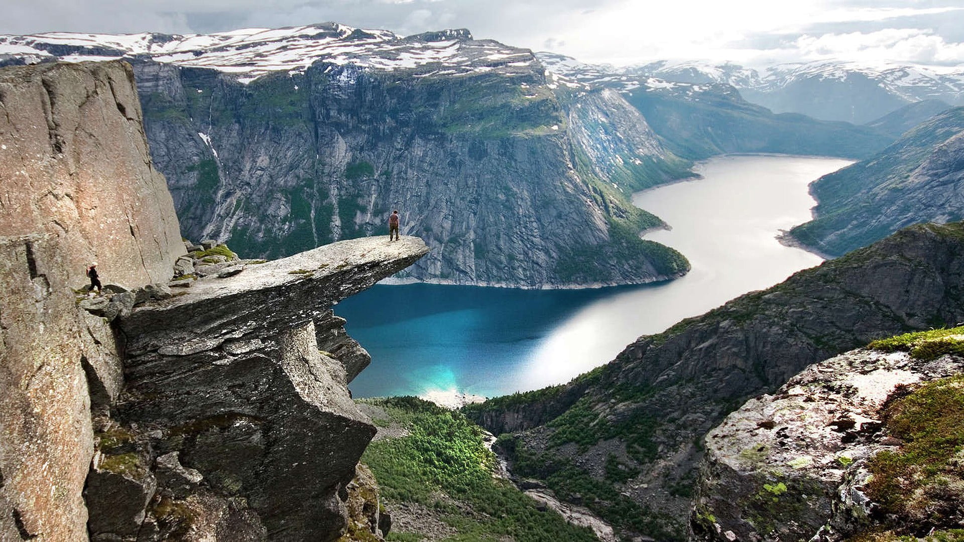 green grass and clear body of water, fjord, sea, cliff, canyon