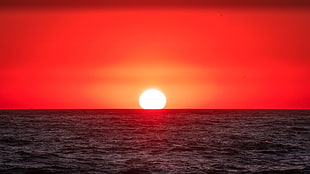 red and white plastic case, sunset, sea