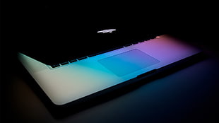 lighted MacBook half-open HD wallpaper