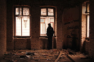 man standing near window HD wallpaper