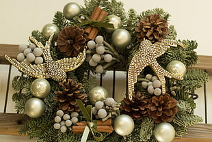 brown pinecone, two gray bird figures, gray baubles wreath