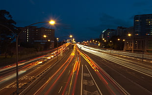 time lapse photo of road with car lights during nighttime