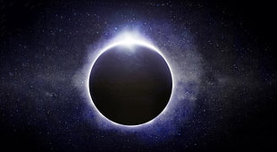 round silver-colored pendant, solar eclipse