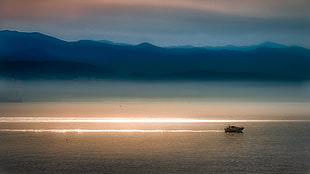 silhouette of yacht on sea horizon HD wallpaper