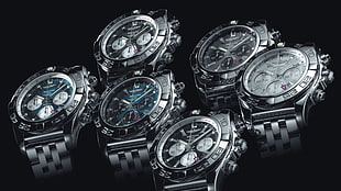 shallow focus photography of six round chronograph watches