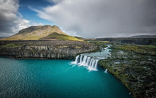waterfalls near mountain during daytime HD wallpaper