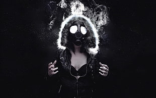 woman wearing gas mask and black leather zip-up jacket