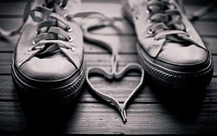 heart shape shoe lace between sneakers