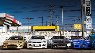 four assorted-color cars, Toyota GT-86, Toyota Supra MK3, Toyota Supra, Toyota