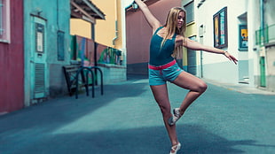 women's black tank top and blue short shorts, ballet, blonde