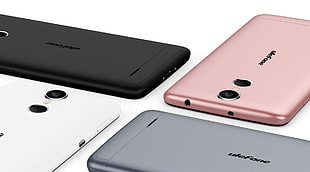 white, black, and rose gold Android smartphones