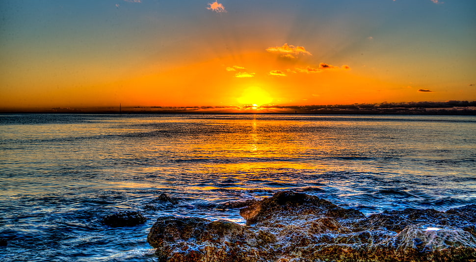 brown rocks in front of seashore during sunset, haleiwa HD wallpaper