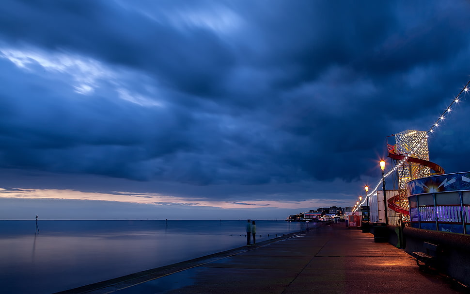 gray sea dock under gray sky during night time HD wallpaper