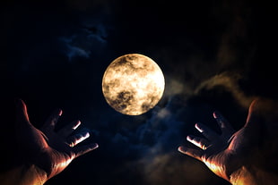 two round silver-colored coins, hands, dark, Moon