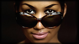 close-up photo of woman with black oversized sunglasses