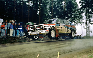 white and red stock car, Lancia Delta Integrale, car, racing, jumping