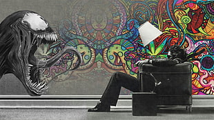 man sitting on black armchair HD wallpaper