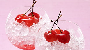 three cherries on top of wine glass with ice