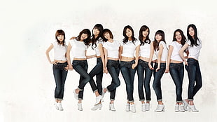 group of women wearing matching white shirts HD wallpaper