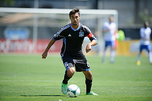 soccer player in black-and-blue 8 Adidas jersey set