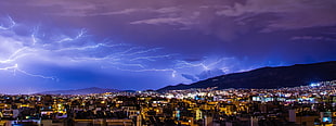 lightning at the sky and city during night HD wallpaper