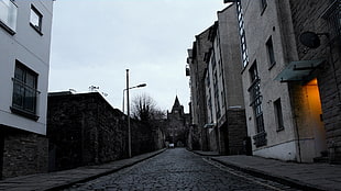 brown concrete buildings, Edinburgh, alleyway, light bulb, clouds