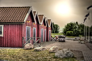 five red wooden barn houses