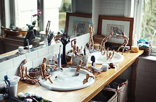 brown wooden figures at kitchen sink, bath, room