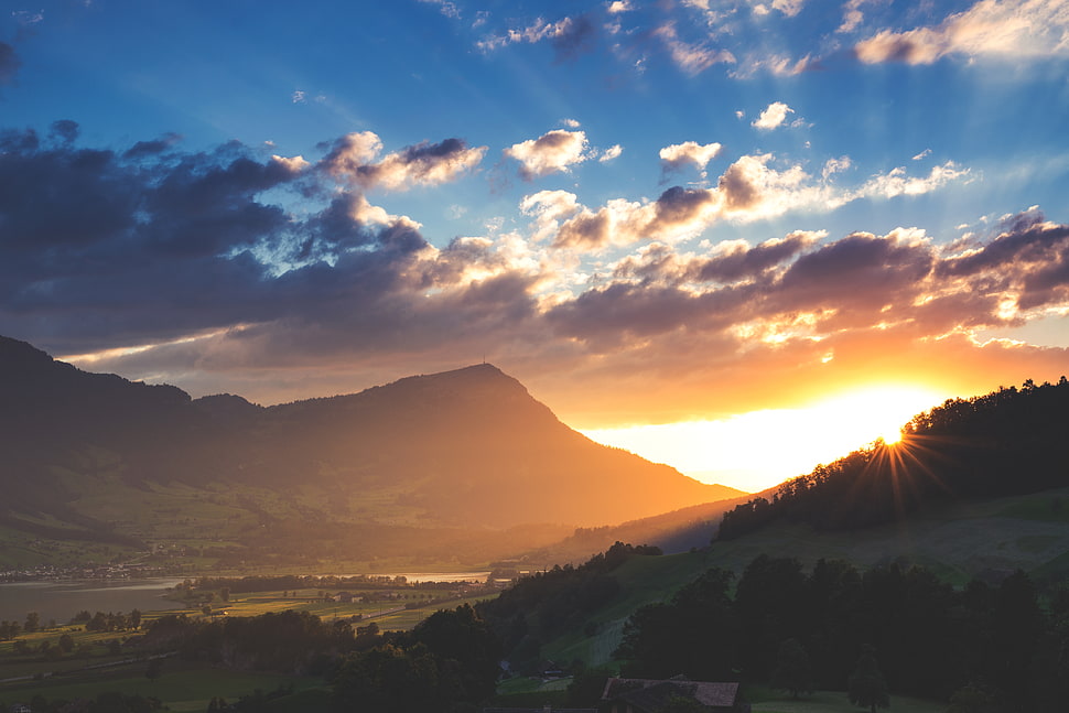 mountain under orange sunset HD wallpaper