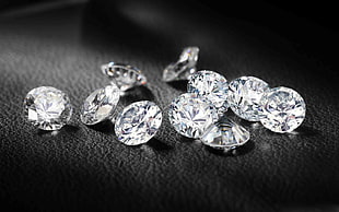 Diamond gemstones on black surface
