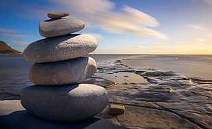 selective focus photography of stack of stones HD wallpaper