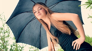 woman holding black umbrella HD wallpaper