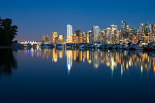 photo of city near calm body of water, vancouver HD wallpaper