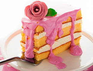 slice of strawberry cake on white ceramic plate