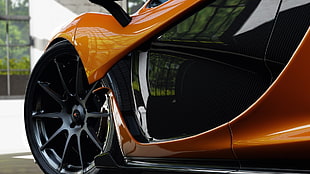 orange and black car in micro photography