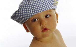 baby wearing blue and white gingham hat HD wallpaper