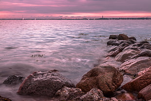 body of water near rock during sunset time-lapse photography, laboe