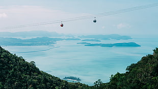 two black cable carts, photography, water, mountains, cable car