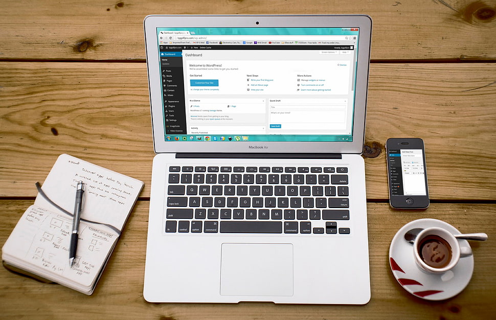 macbook air on brown wooden table HD wallpaper