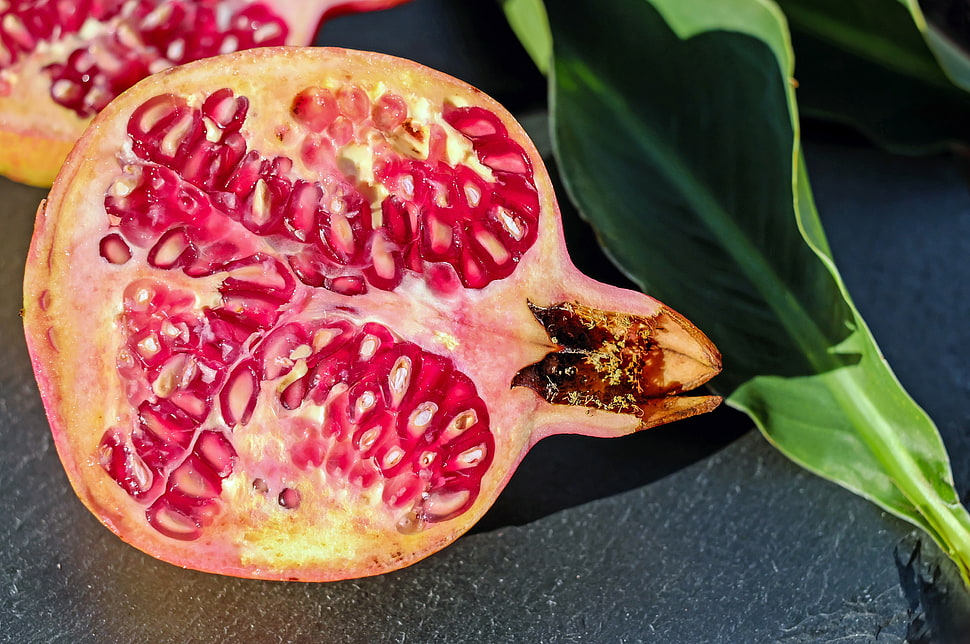 red pomegranate fruit in shallow focus photography HD wallpaper