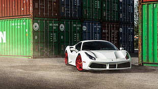 white Ferrari 458 Sypder near shipping containers