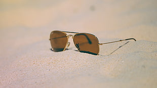 brown Ray-Ban Aviator sunglasses with silver frames, sand, glasses, beach