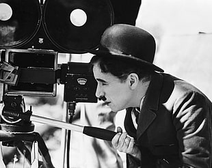 Charlie Chaplin holding video camera HD wallpaper