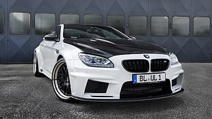 white and black BMW coupe parking HD wallpaper