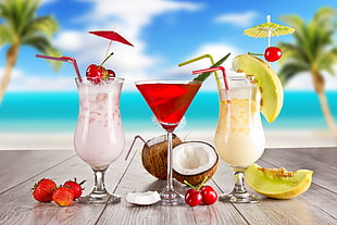 depth of field photography of cocktails in drinking glasses on brown table HD wallpaper