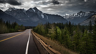 concrete road towards mountain