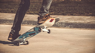 white and blue skateboard